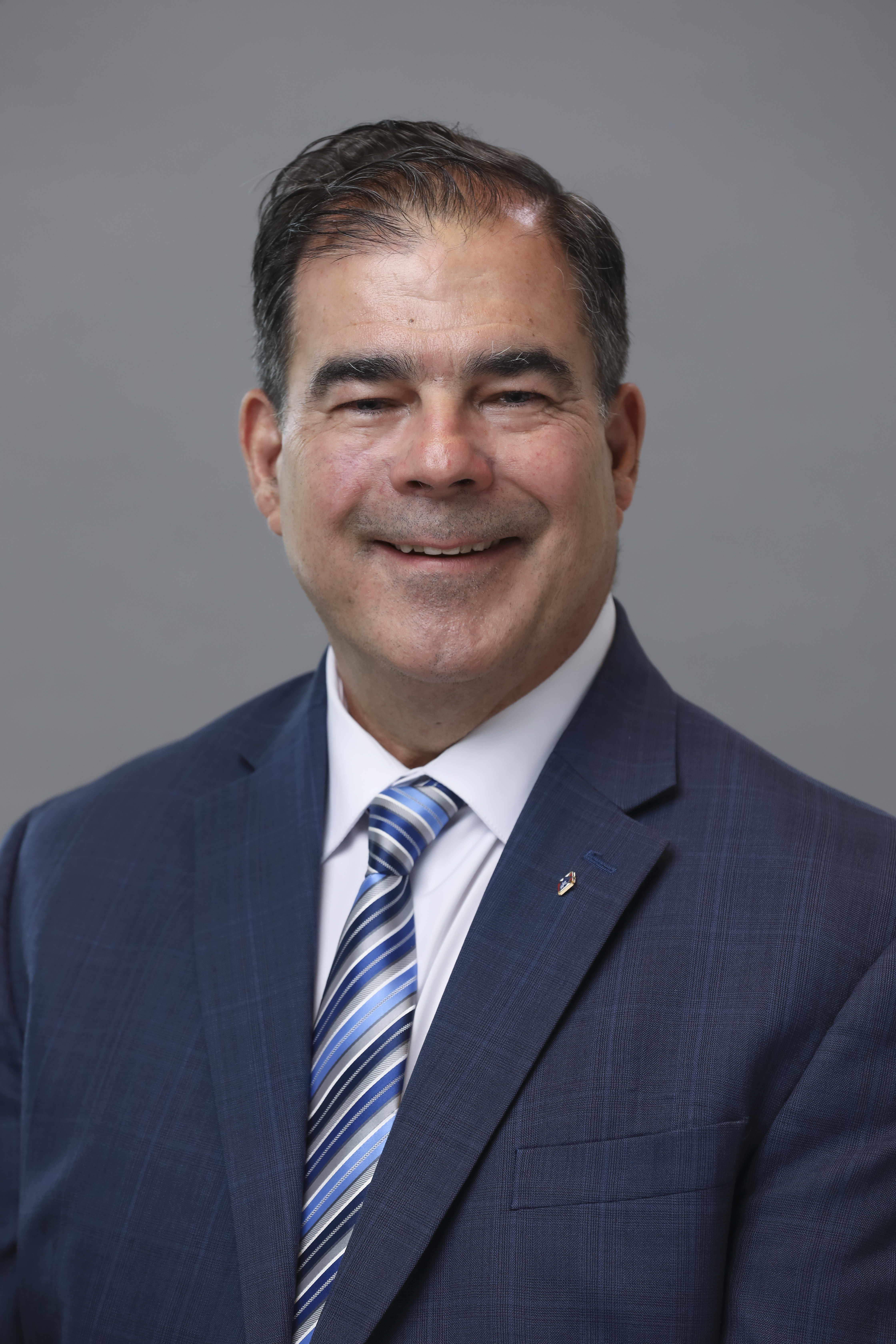 A professional headshot of Michael F Burkitt 